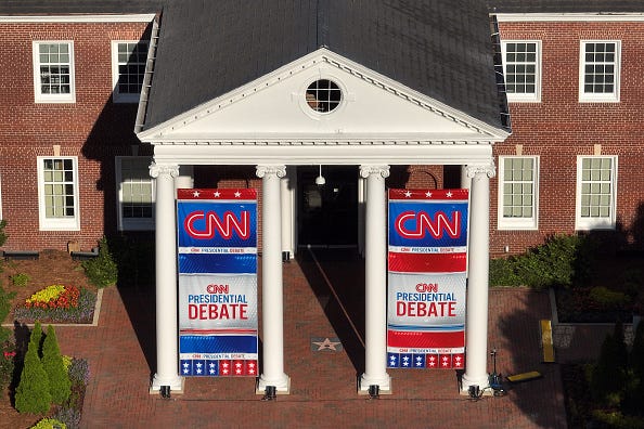In an aerial view, signage for a CNN presidential debate is seen outside of their studios inside the Turner Entertainment Networks on June 26, 2024 in Atlanta, Georgia. U.S. President Joe Biden and Republican presidential candidate, former U.S. President Donald Trump will face off in the first presidential debate of the 2024 presidential cycle
