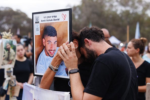 People gathered at a memorial at the site of the Nova music festival, one year after the October 7 attack. Israel has been in a state of war since Hamas stormed southern Israeli communities and military bases on Oct. 7 last year, killing 1,200 people and abducting 250.