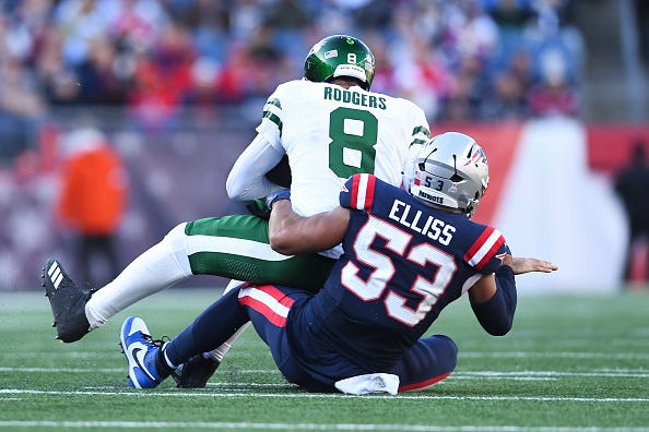 Christian Elliss and Aaron Rodgers