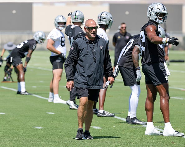 Special teams coordinator Tom McMahon of the Las Vegas Raiders walks on a field during mandatory minicamp at the Las Vegas Raiders Headquarters/Intermountain Healthcare Performance Center on June 10, 2025 in Henderson, Nevada. 