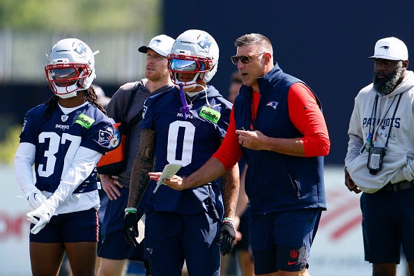 Mike Vrabel and Christian Gonzalez