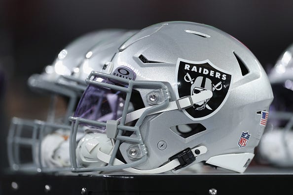 A row of Las Vegas Raiders helmets