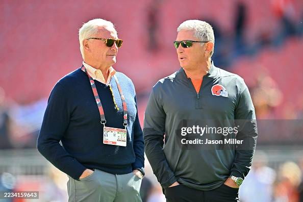 Jimmy Haslam, co-owner of the Cleveland Browns, speaks with defensive coordinator Jim Schwartz prior to the game against the Cincinnati Bengals during the game at Huntington Bank Field on September 07, 2025 in Cleveland, Ohio