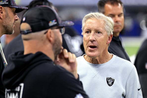 Head coach Pete Carroll of the Las Vegas Raiders talks to his coaching staff on the sideline during the second quarter against the Indianapolis Colts in the game at Lucas Oil Stadium on October 05, 2025 in Indianapolis, Indiana.