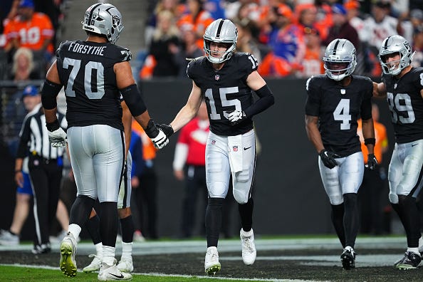 Kenny Pickett #15 of the Las Vegas Raiders runs off the field after throwing a touchdown pass during the fourth quarter against the Denver Broncos at Allegiant Stadium on December 07, 2025 in Las Vegas, Nevada.