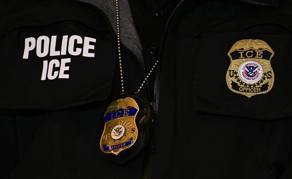  An ICE patch and badge are seen on a Department of Homeland Security agent in Minneapolis, Minnesota