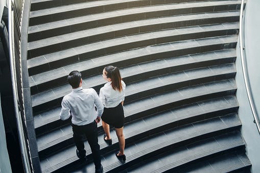 Couple Walking Up Steps