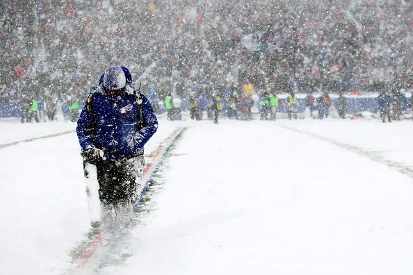 A man clears yard markers during the second quarter of a game between the Buffalo Bills and Indianapolis Colts on December 10, 2017 at New Era Field in Orchard Park, New York.