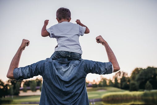 Son On Dad's Shoulders