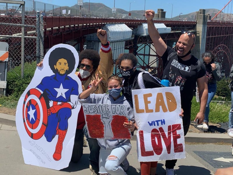 The rally's organizer, 17-year-old Tiana Day, seen (center) with other protesters.