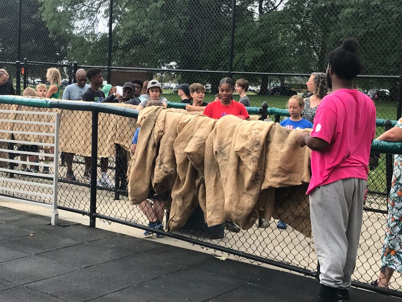 Burlap sacks are provides for riders of the Giant Slide on Belle Isle