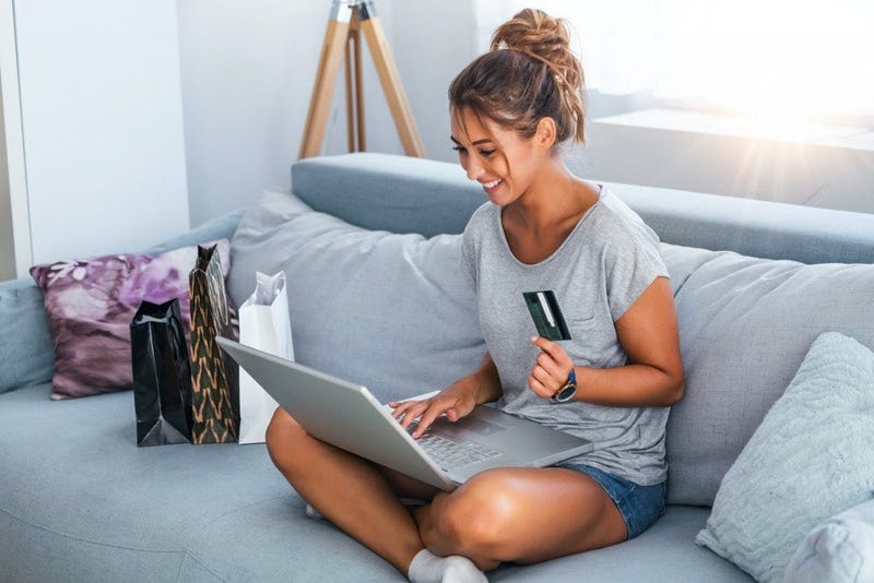 girl on couch online shopping