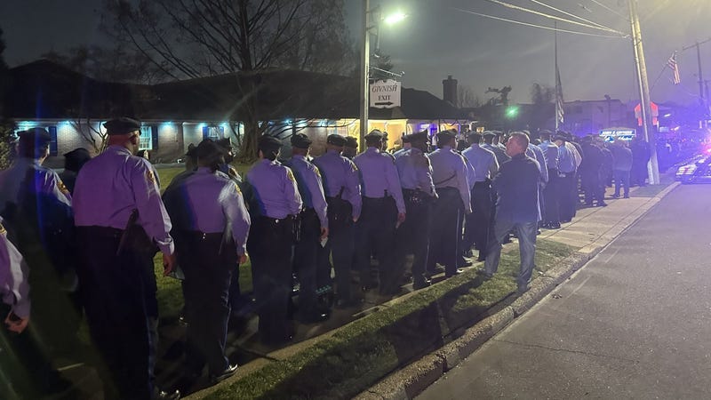 A line of law enforcement officers at John Givnish Funeral Home in Northeast Philadelphia Thursday night came to grieve the shooting death of Temple University Police Officer Chris Fitzgerald.