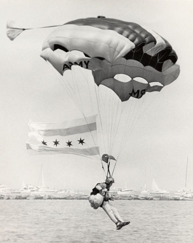 A U.S. Army Golden Knight prepares to land on the shores of Lake Michigan during the Chicago Air and Water Show.