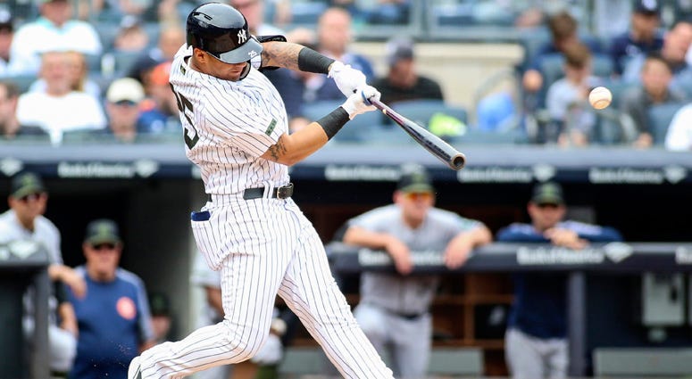 The Yankees' Gleyber Torres throws to first base during a spring training game against the Philadelphia Phillies on Feb. 25, 2018, at Spectrum Field in Clearwater, Florida.