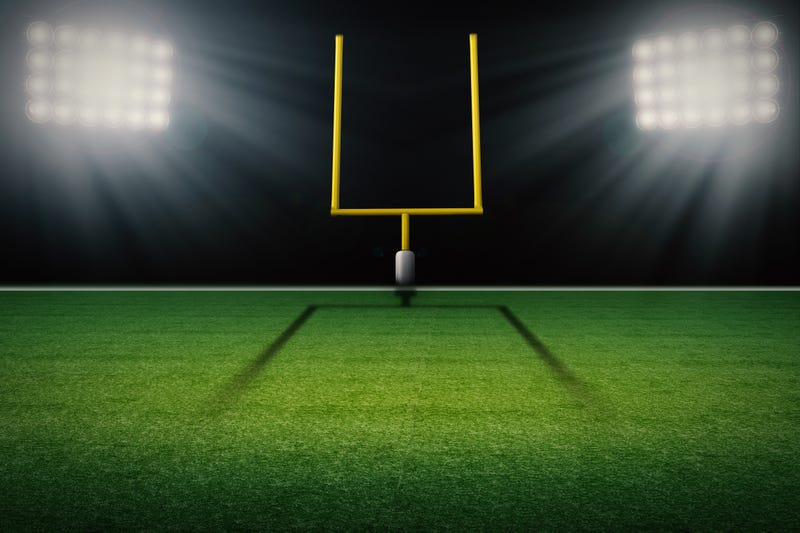 Football field goal post with empty field