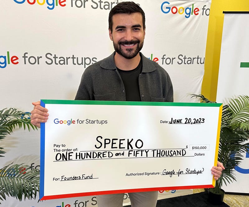 man holding giant check
