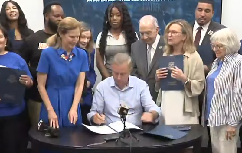 Lt. Gov. Susan Bysiewicz, Gov. Ned Lamont, state Senate Pres. Martin Looney and state Sen. Julie Kushner at a bill signing in New Haven, 5/28/24