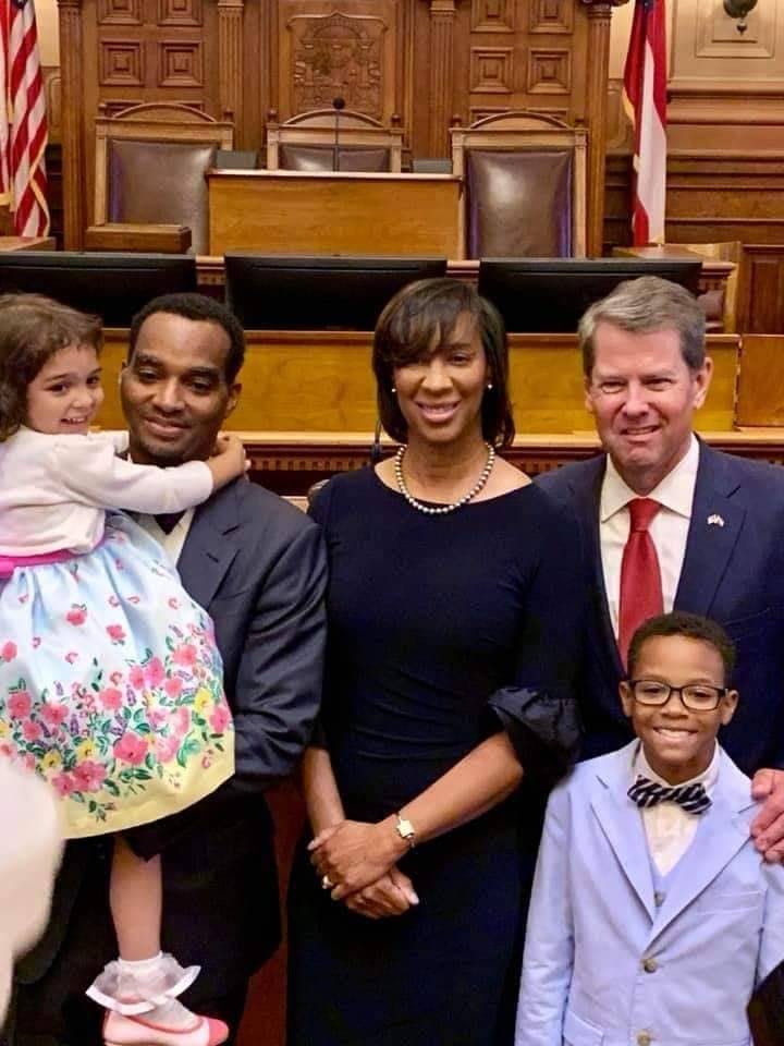 Gov. Kemp is shown with Shondeana Morris and family. He placed her on the Superior Court bench in DeKalb County.