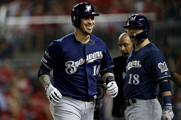Yasmani Grandal celebrates a home run with the Brewers. 