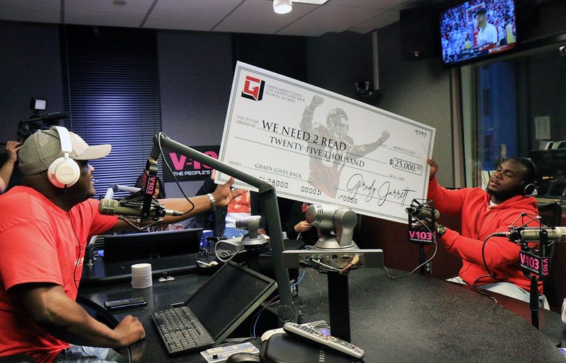Greg Street receives $25,000 donation from Atlanta Falcons player Grady Jarrett for his We Need 2 Read program