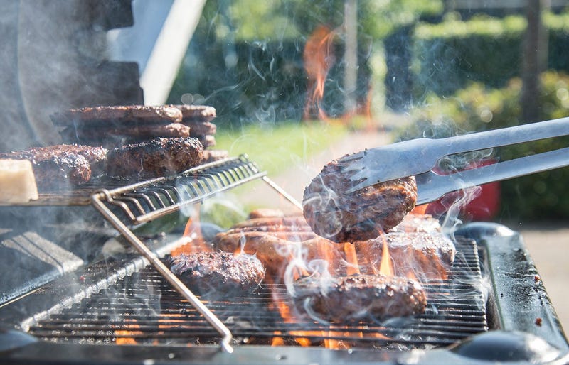 A grill with flame-broiling meats 