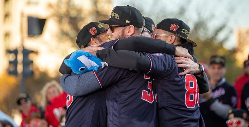 Washington Nationals players and coaches roll through the streets of Washington, D.C. and then speak on stage, celebrating their 2019 World Series championship with a few hundred thousand fans on November 2, 2019. 