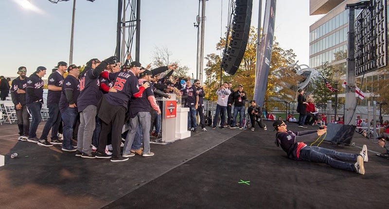 Washington Nationals players and coaches roll through the streets of Washington, D.C. and then speak on stage, celebrating their 2019 World Series championship with a few hundred thousand fans on November 2, 2019. 