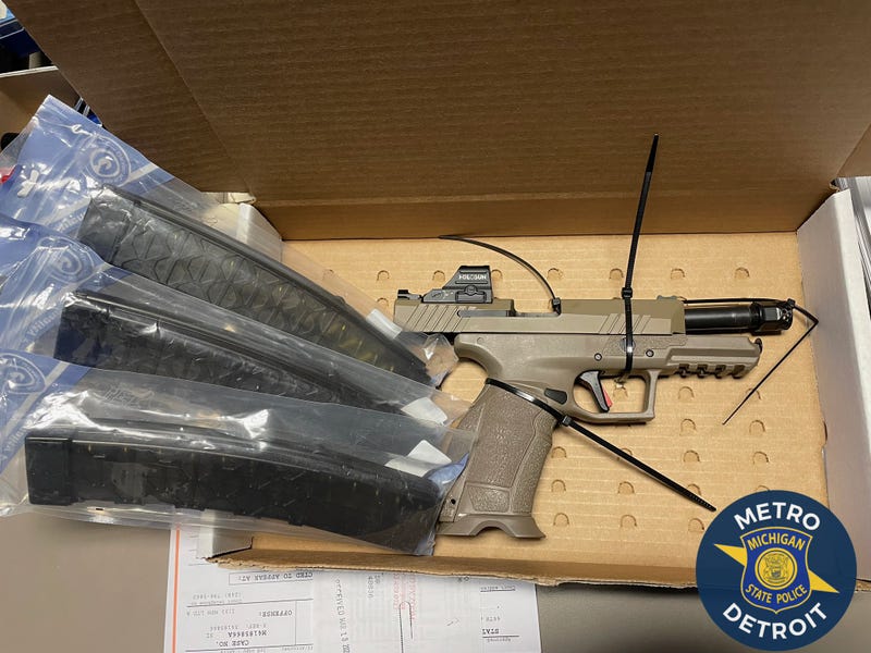 A gun an magazines seized by MSP troopers following a crash on I-75.