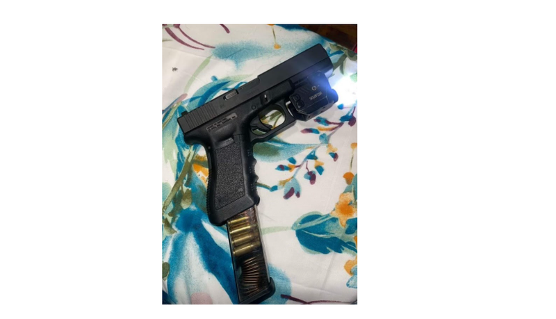 9-millimeter semi-automatic pistol with a magazine feeder