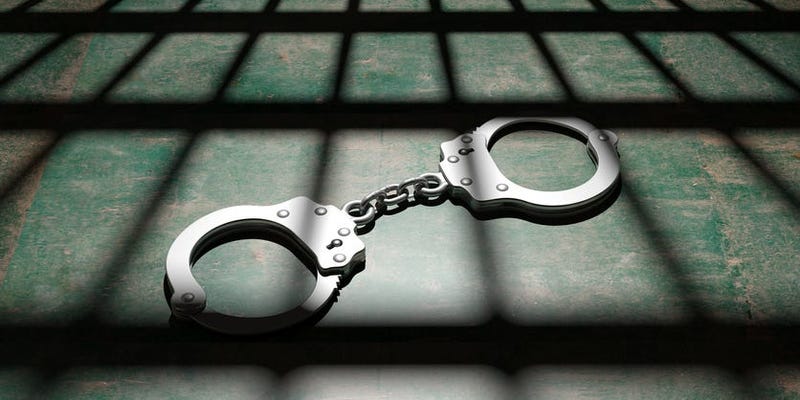 Handcuffs and Shadows of Jail Bars
