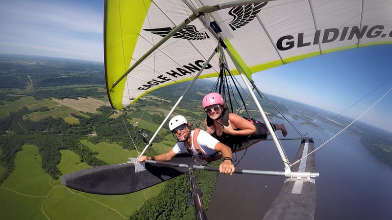 Eagle Hang Gliding owner David Dysband and a happy customer soaring over Lake Pepin