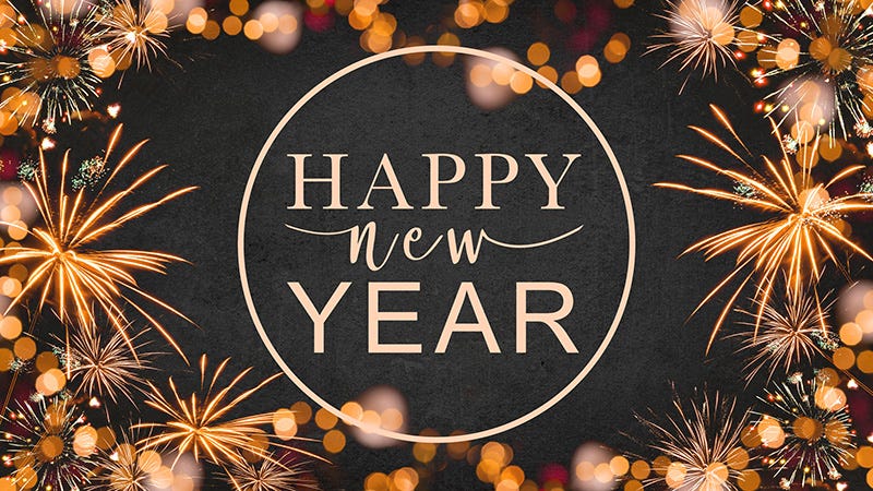 Happy New Year text on fireworks and lights background