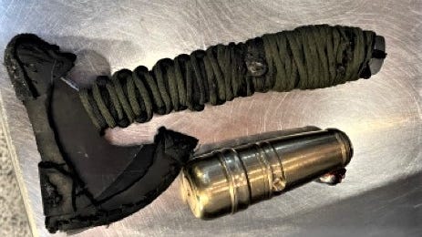 Hatchet, homemade gun found in man's carry-on luggage