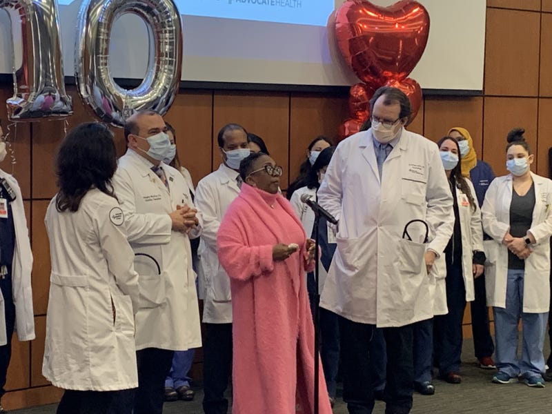 Nikki Brown surrounded by doctors