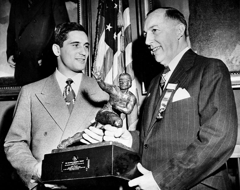 Heisman trophy held by Johnny Lujack