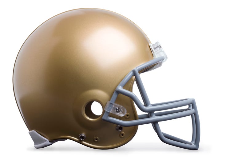 Gold football helmet isolated on white