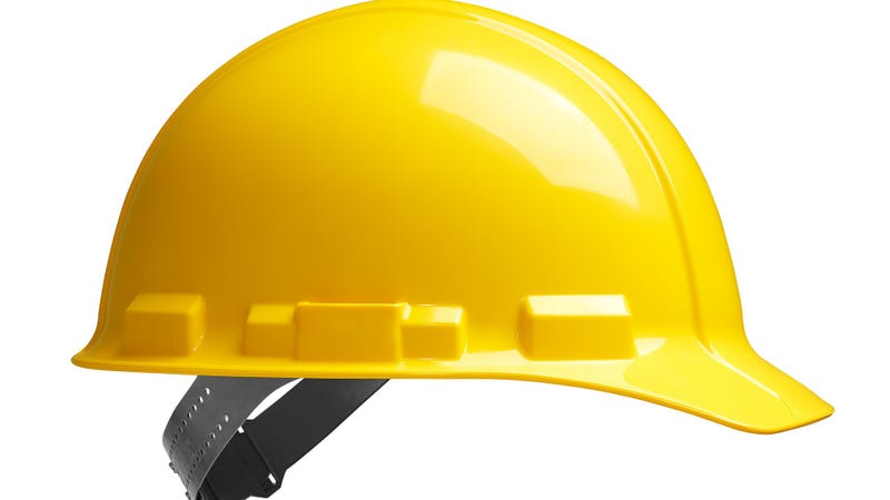 Side view of yellow safety helmet - stock photo