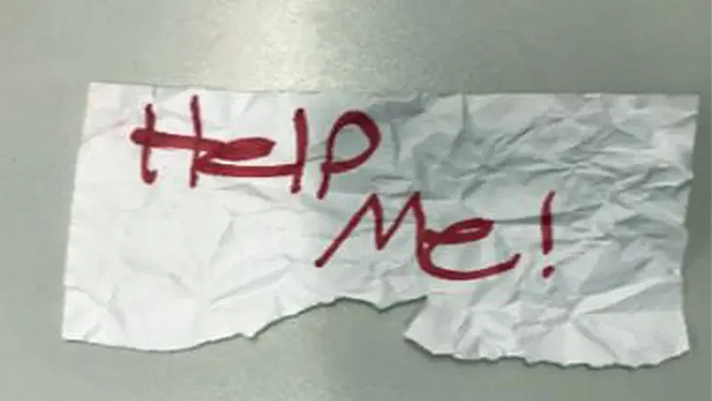 help me written on a scrap of paper