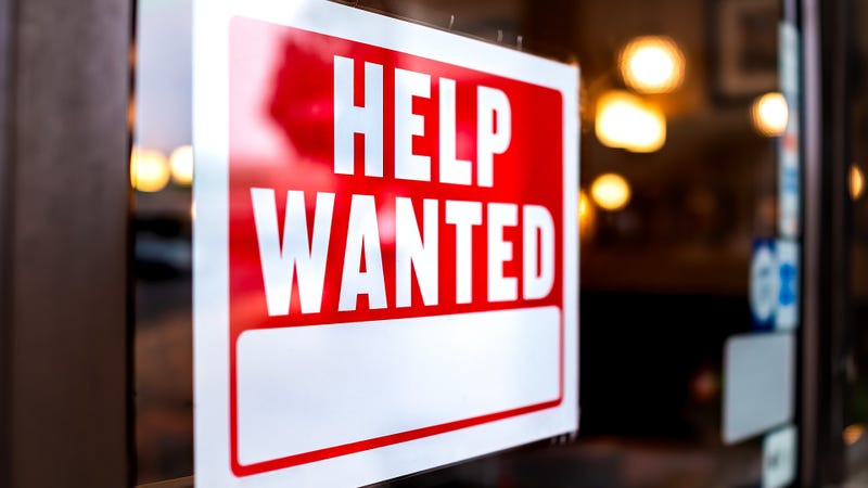 Sign text closeup for help wanted with red and white colors - stock photo