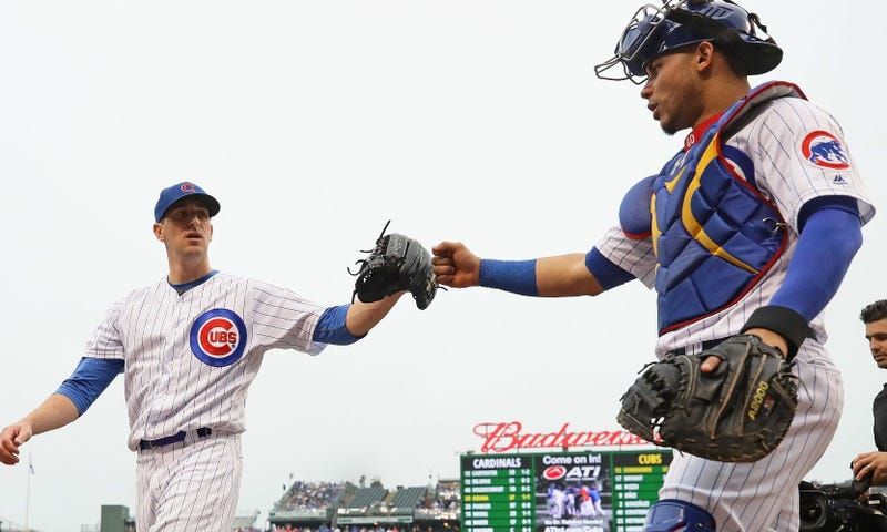 Cubs right-hander Kyle Hendricks, left, is congratulated by catcher Willson Contreras.