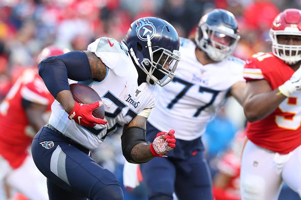 Derrick Henry looks for a lane to run with the Tennessee Titans. 
