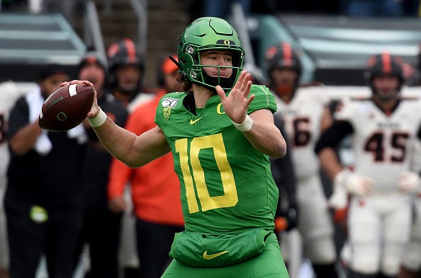 Justin Herbert winds up in a game for Oregon. 