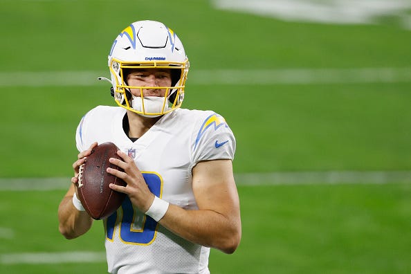 Justin Herbert warms up before a Chargers game.