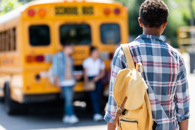 high school student with back pack