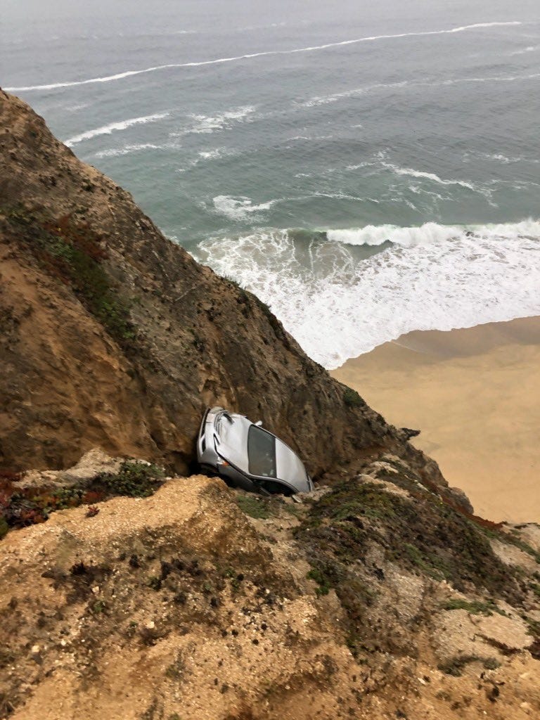A woman has reportedly died after driving off of Highway 1 and down a cliff.