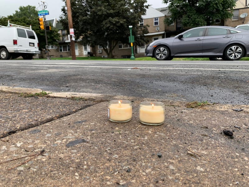 The owner of a day care center on Haverford Avenue lit these candles to remember the 35-year-old man who died yesterday. She learned he was killed here on his birthday.