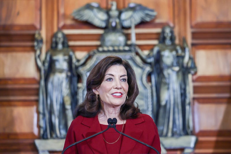 A pair of political pundits peruse the 2024 budget proposal announced by Governor Kathy Hochul Wednesday. They expect a showdown between Hochul and the legislature on some items.