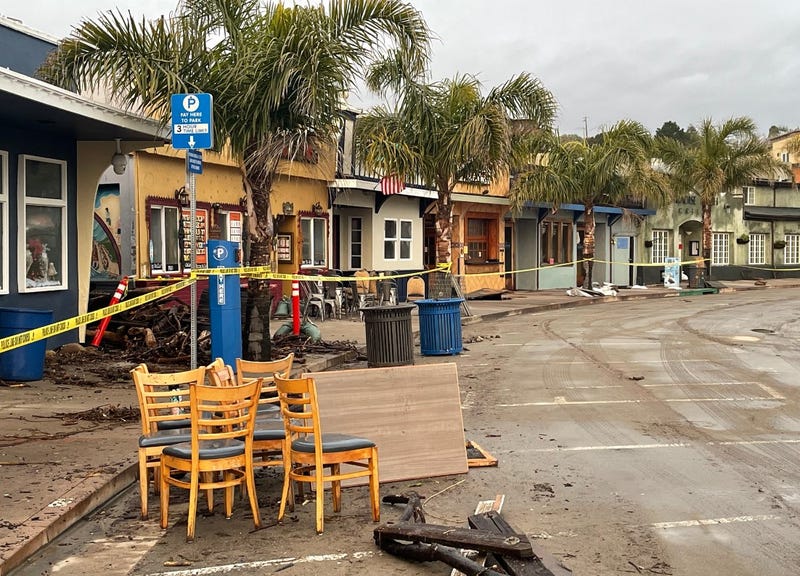 Crews are working to cleanup the area during Friday's brief lull in between storms.