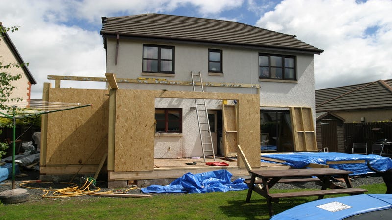 A home with an extension being built - stock photo